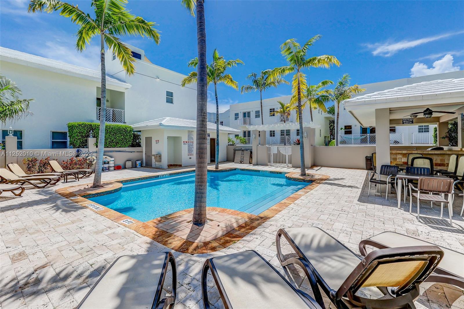 1037 Southwest 9th Court, Unit E1 Miami, FL 33130 - Photo 20 of 26 a view of a house with swimming pool and sitting area