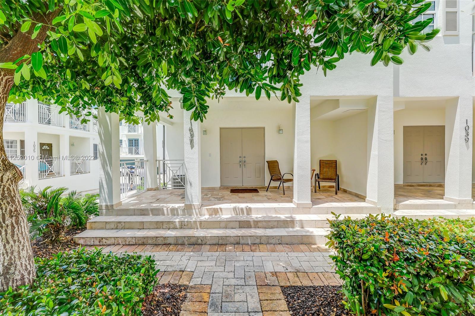 1037 Southwest 9th Court, Unit E1 Miami, FL 33130 - Photo 22 of 26 a front view of a house with garden