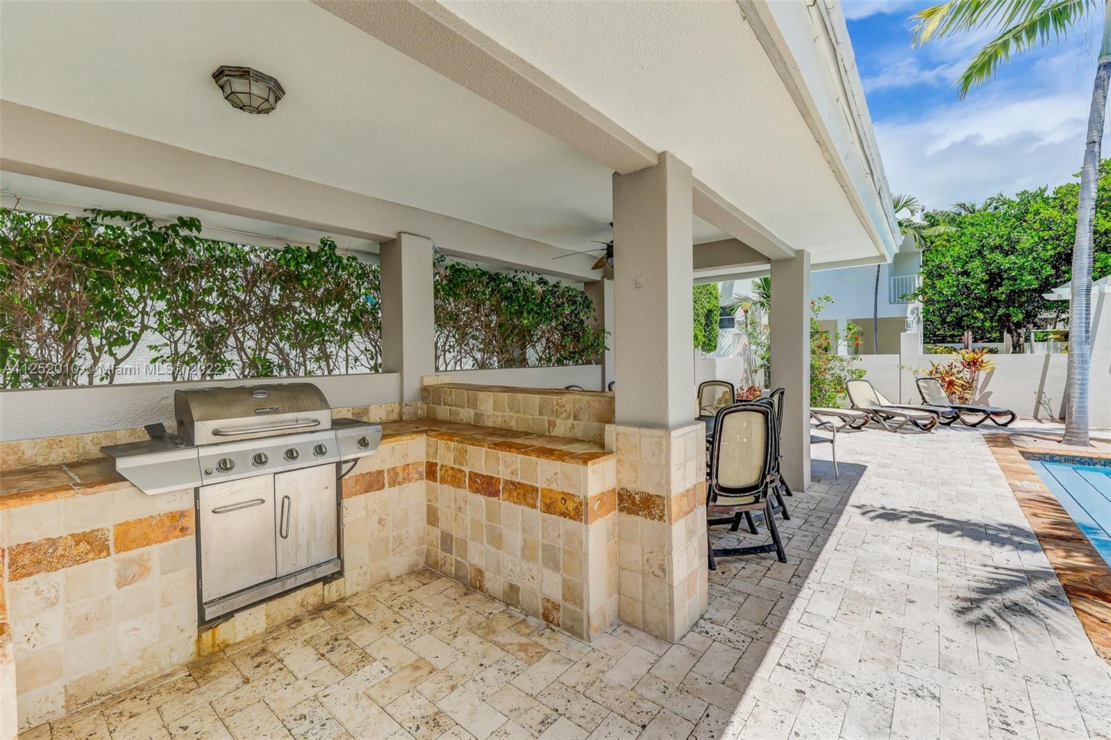 1037 Southwest 9th Court, Unit E1 Miami, FL 33130 - Photo 24 of 26 a open kitchen with a sink stove and refrigerator