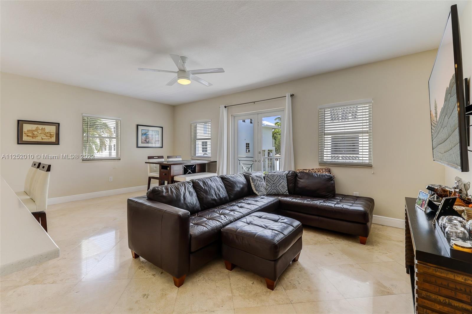 1037 Southwest 9th Court, Unit E1 Miami, FL 33130 - Photo 8 of 26 a living room with furniture and a window