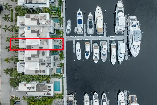 an aerial view of a house with a ocean view