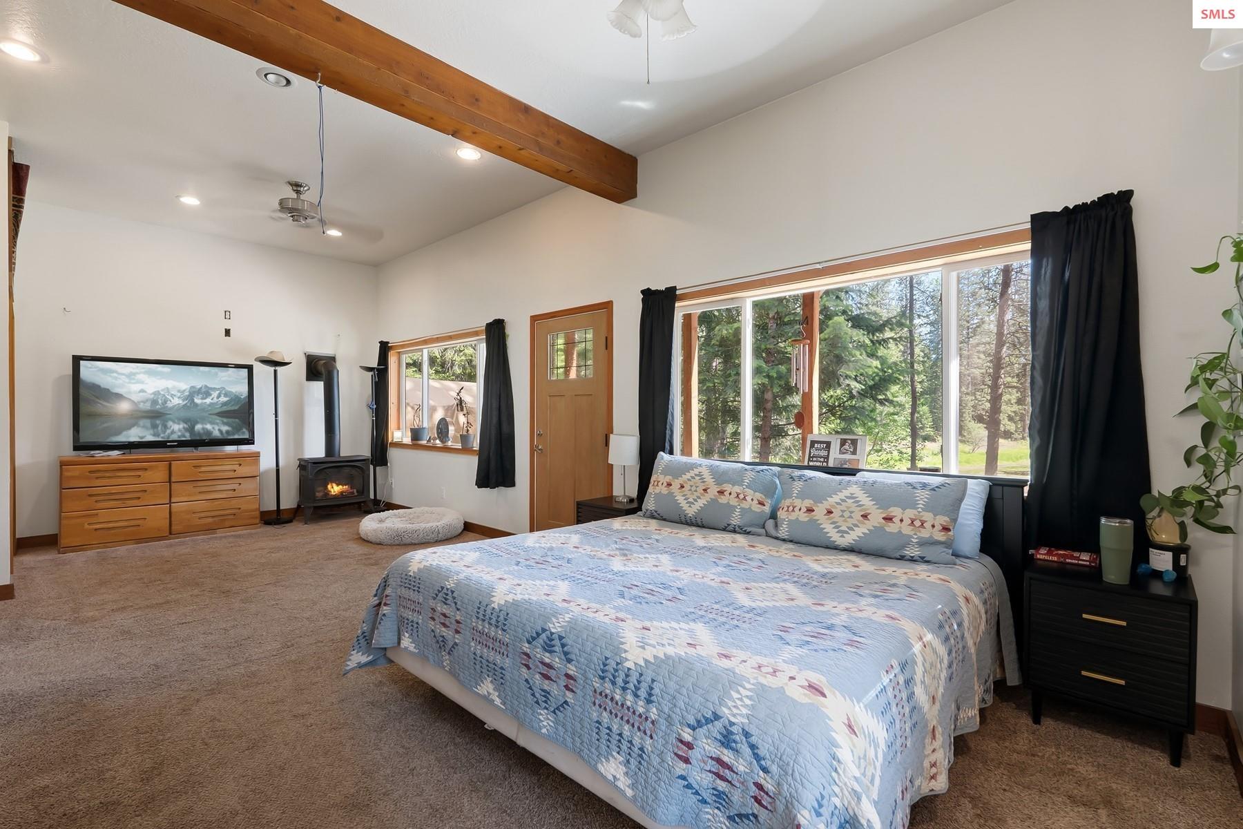 2206 Gypsy Bay Road Sagle, ID 83860 - Photo 5 of 42 The Primary Bedroom on the main floor has access to the newly added back patio