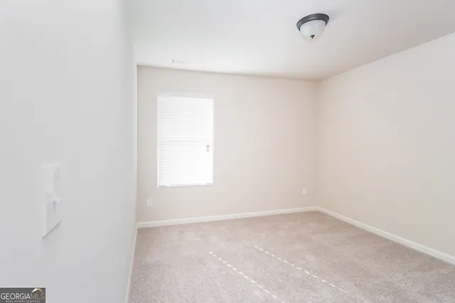 a view of a room that has a window in it