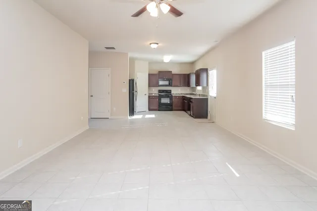 a view of a kitchen with a sink and a window