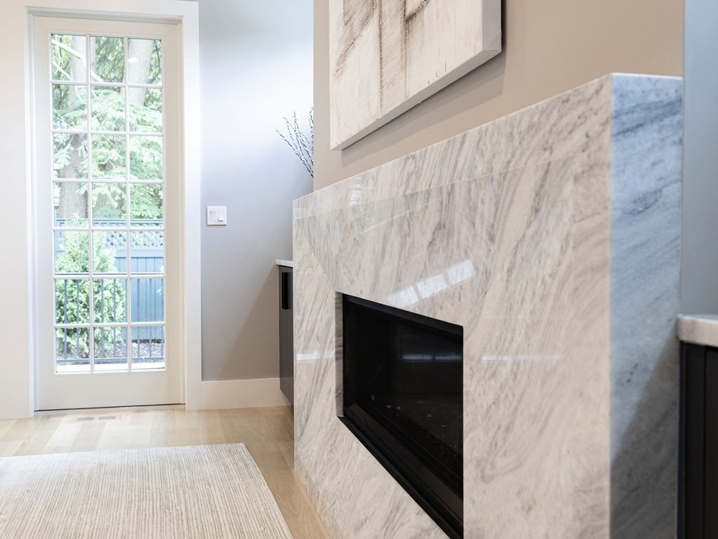 20 Bound Brook Road Newton, MA 02461 - Photo 18 of 40 a living room with a fireplace and a window