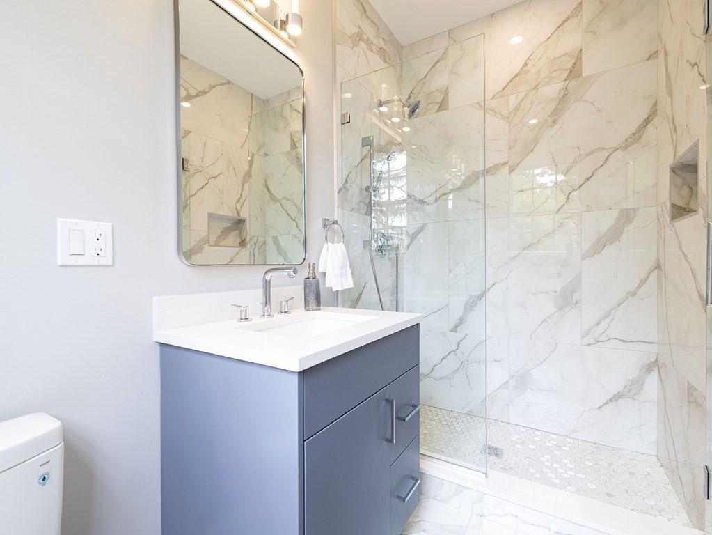20 Bound Brook Road Newton, MA 02461 - Photo 30 of 40 a bathroom with a sink a toilet and a mirror