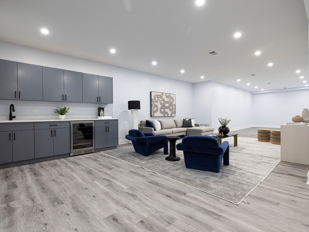 20 Bound Brook Road Newton, MA 02461 - Photo 33 of 40 a living room with furniture a wooden floor and kitchen view