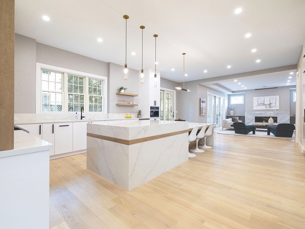 20 Bound Brook Road Newton, MA 02461 - Photo 8 of 40 a large kitchen with kitchen island a large counter top a sink a window and stainless steel appliances