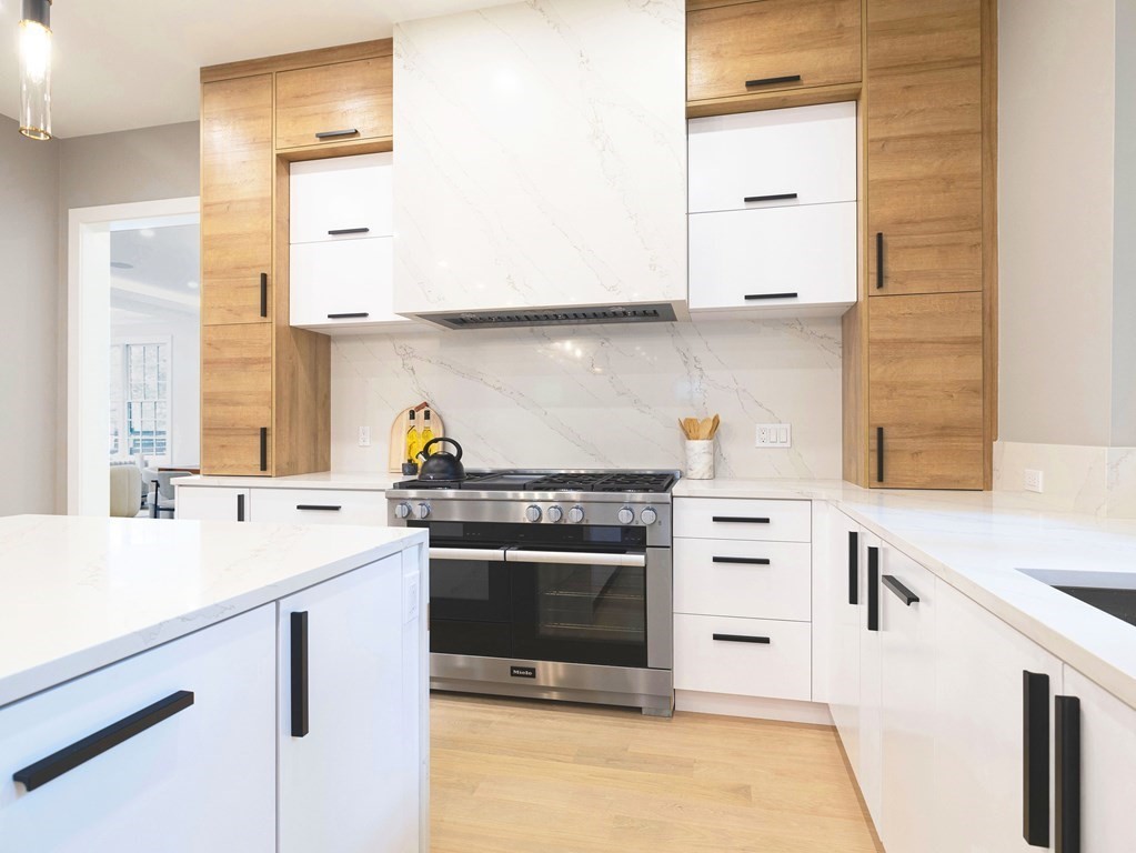 20 Bound Brook Road Newton, MA 02461 - Photo 10 of 40 a kitchen with a sink stove and cabinets