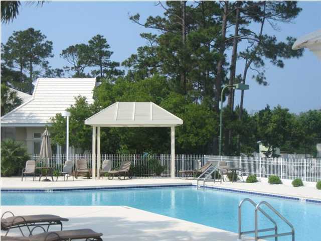 Lot 8 White Cliffs Boulevard Santa Rosa Beach, FL 32459 - Photo 2 of 23 a view of a patio with couches table and chairs and potted plants