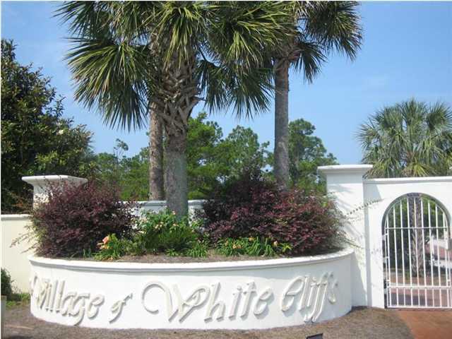 Lot 8 White Cliffs Boulevard Santa Rosa Beach, FL 32459 - Photo 21 of 23 a view of front of house with a sign board