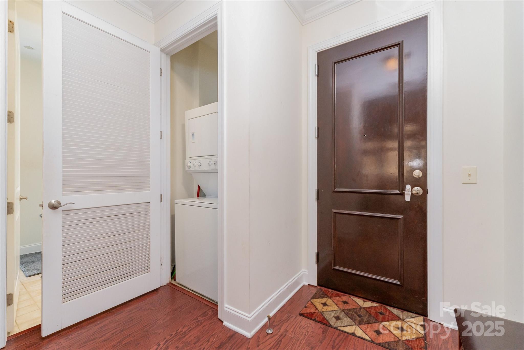 230 South Tryon Street, Unit 1105 Charlotte, NC 28281 - Photo 26 of 33 a view of walk in closet with wooden floor