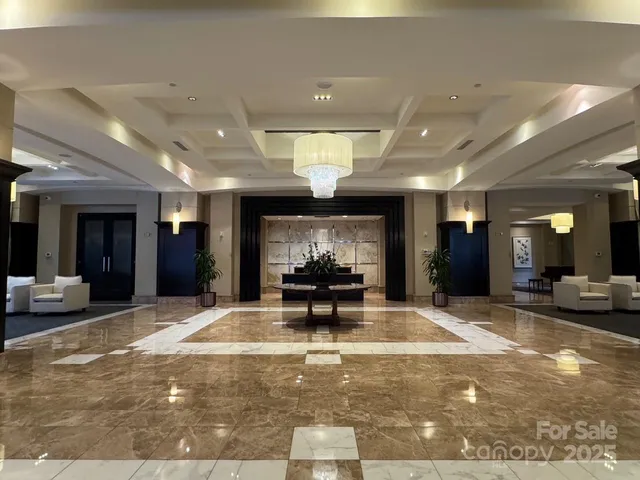 a view of a lobby with black carpet