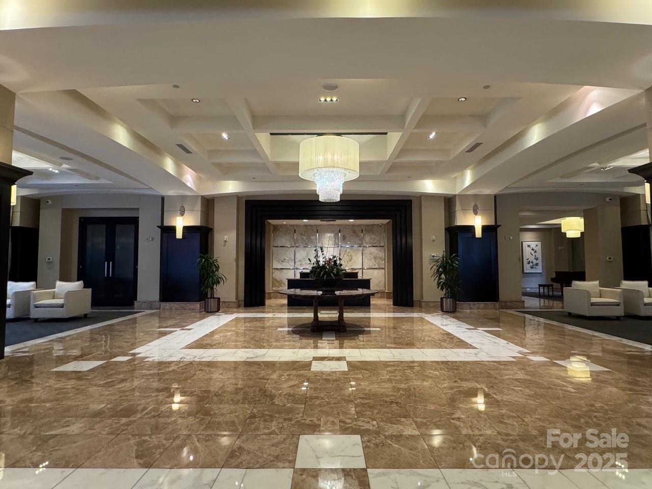 230 South Tryon Street, Unit 1105 Charlotte, NC 28281 - Photo 27 of 33 a view of a lobby with black carpet