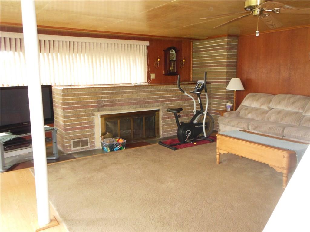 209 Hoover Road New Castle, PA 16101 - Photo 4 of 17 Living room with log burning fireplace
