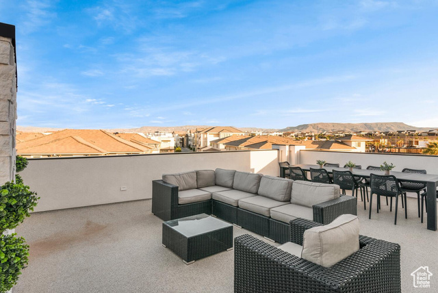 5367 Cyan Lane St. George, UT 84790 - Photo 29 of 36 View of patio featuring a residential view, outdoor dining space, outdoor lounge area, and a mountain view
