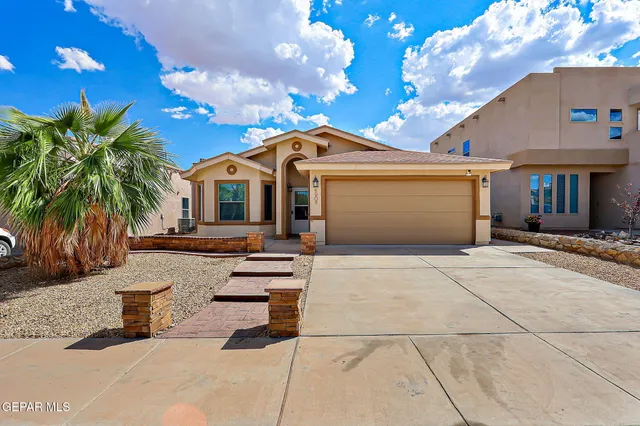 a front view of a house with yard