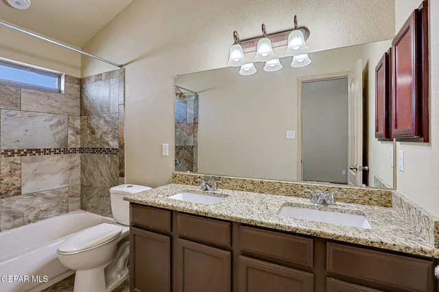 a bathroom with a bathtub and shower