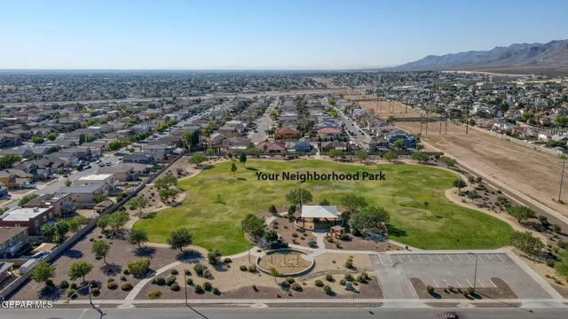 an aerial view of a residential houses with outdoor space