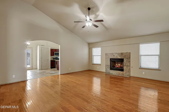a view of a dining room with furniture wooden floor and a chandelier