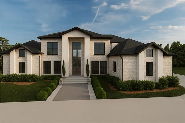 a front view of a house with a yard