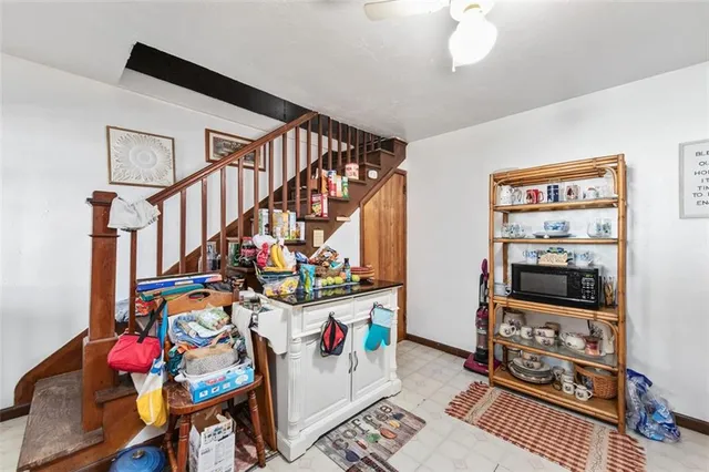 a view of a livingroom with furniture and toys