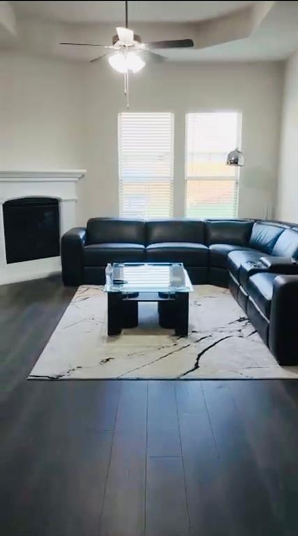 3935 Sidney Lane Forney, TX 75126 - Photo 2 of 4 a living room with furniture and a fireplace