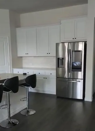 a kitchen with appliances and cabinets