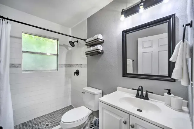 a view of a chairs and table in the wooden deck