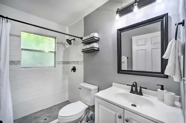 a view of a chairs and table in the wooden deck