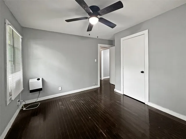 a bathroom with a sink a glass door shower and mirror