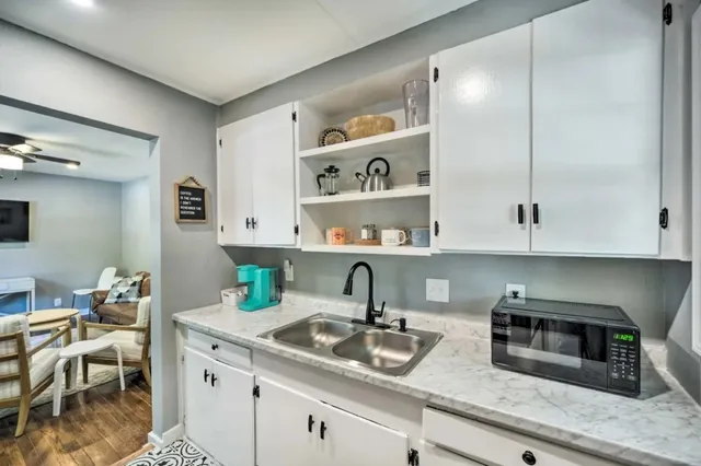 a kitchen with a sink and cabinets