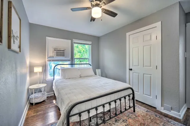 a bedroom with a bed and a table