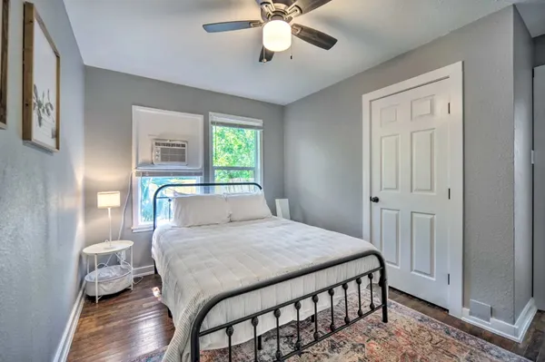 a bedroom with a bed and a table