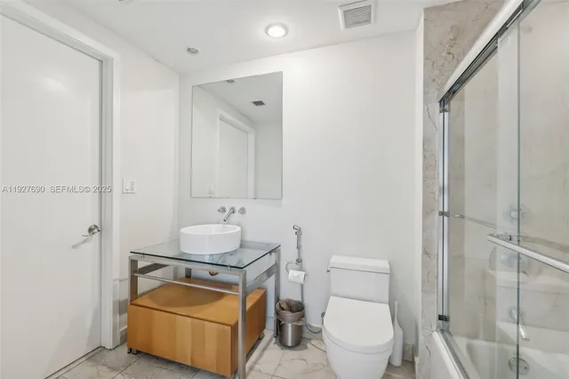 a bathroom with a toilet and a sink