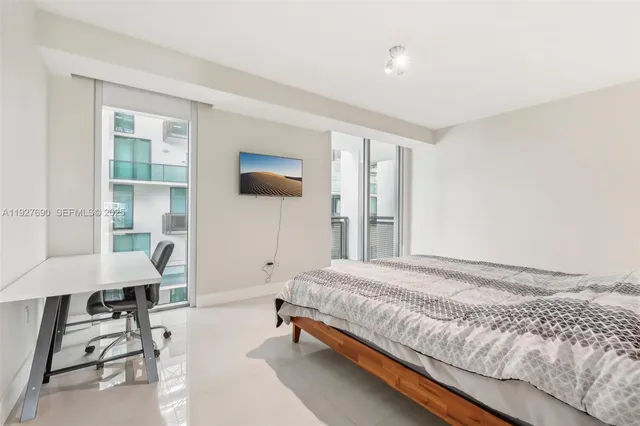 a bathroom with a shower and a sink