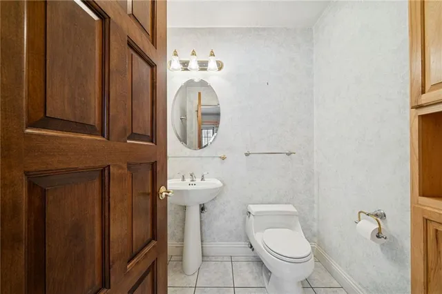 a bathroom with a toilet and a sink