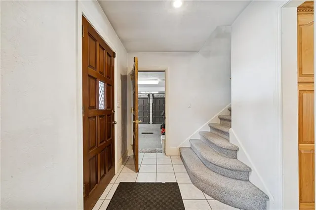 a view of entryway and hall with a floor to ceiling window