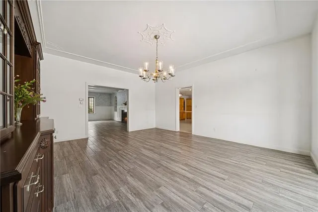 a view of a chandelier and wooden floor