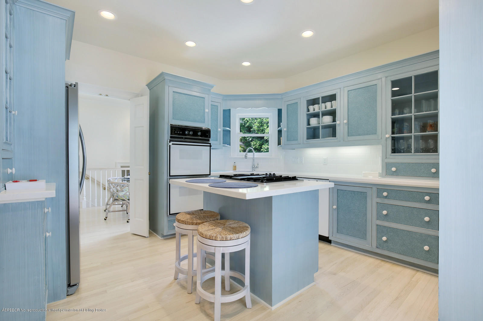 133 Gulfstream Road Palm Beach, FL 33480 - Photo 6 of 20 a kitchen with a sink and chairs