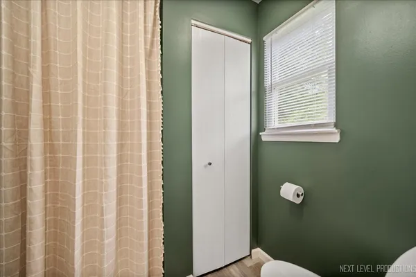 a bathroom with a sink a mirror and a toilet