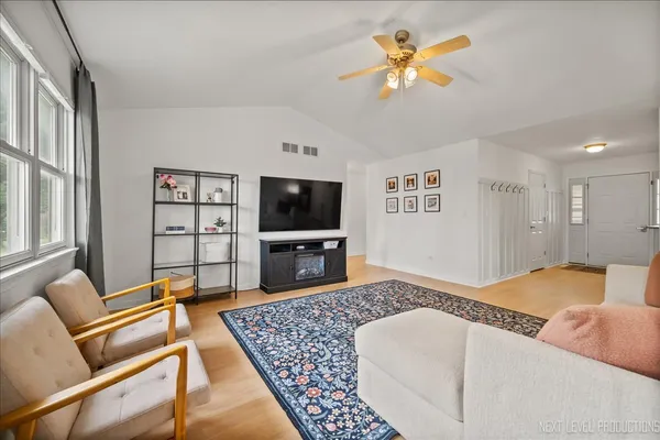 a living room with furniture and a flat screen tv