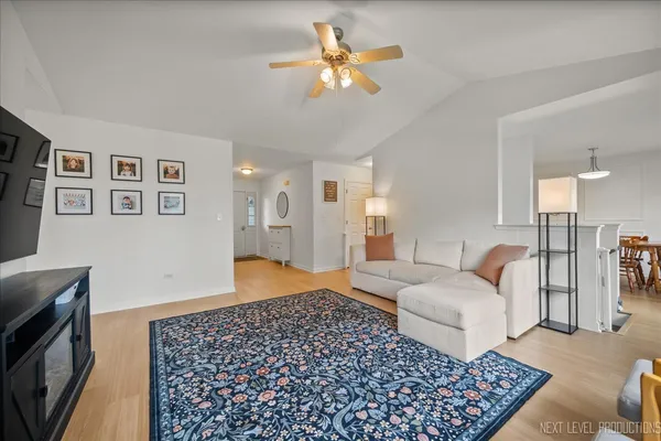 a bedroom with furniture and a rug