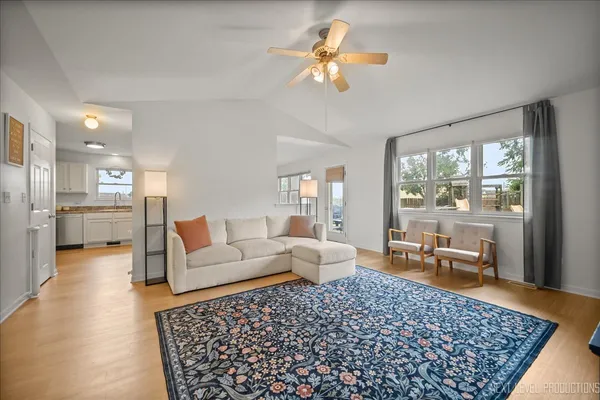 a living room with furniture and a rug