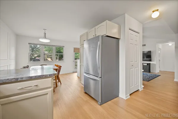 a kitchen with stainless steel appliances a refrigerator and a sink