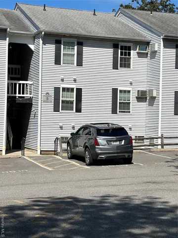 a view of a car parked in front of a house