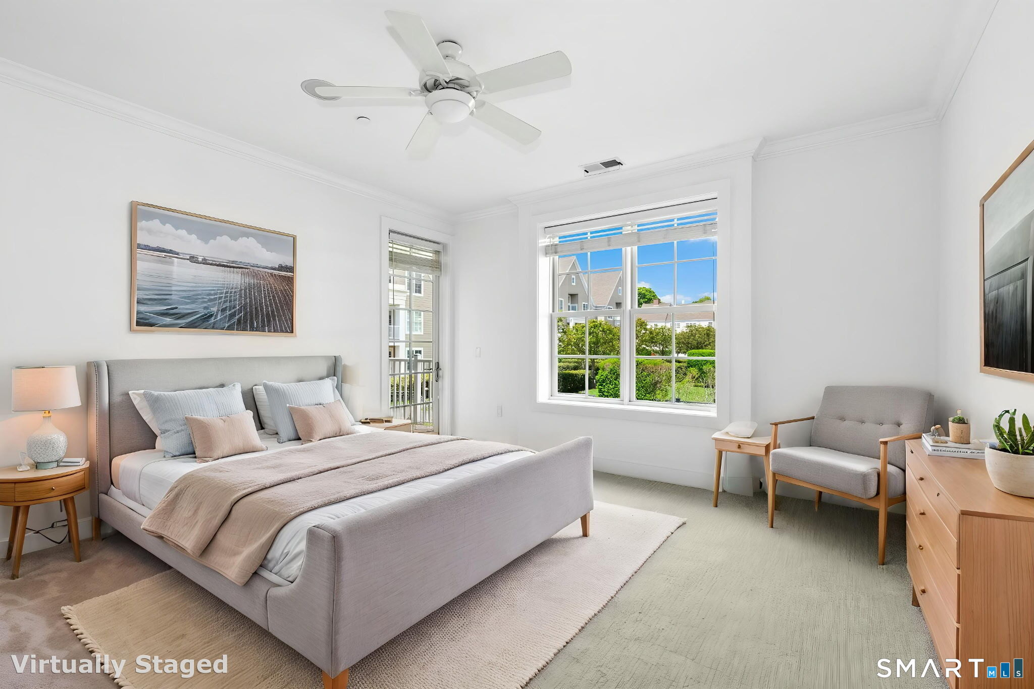 77 Havemeyer Lane, Unit 310 Stamford, CT 06902 - Photo 12 of 22 a spacious bedroom with a bed a couch and a window