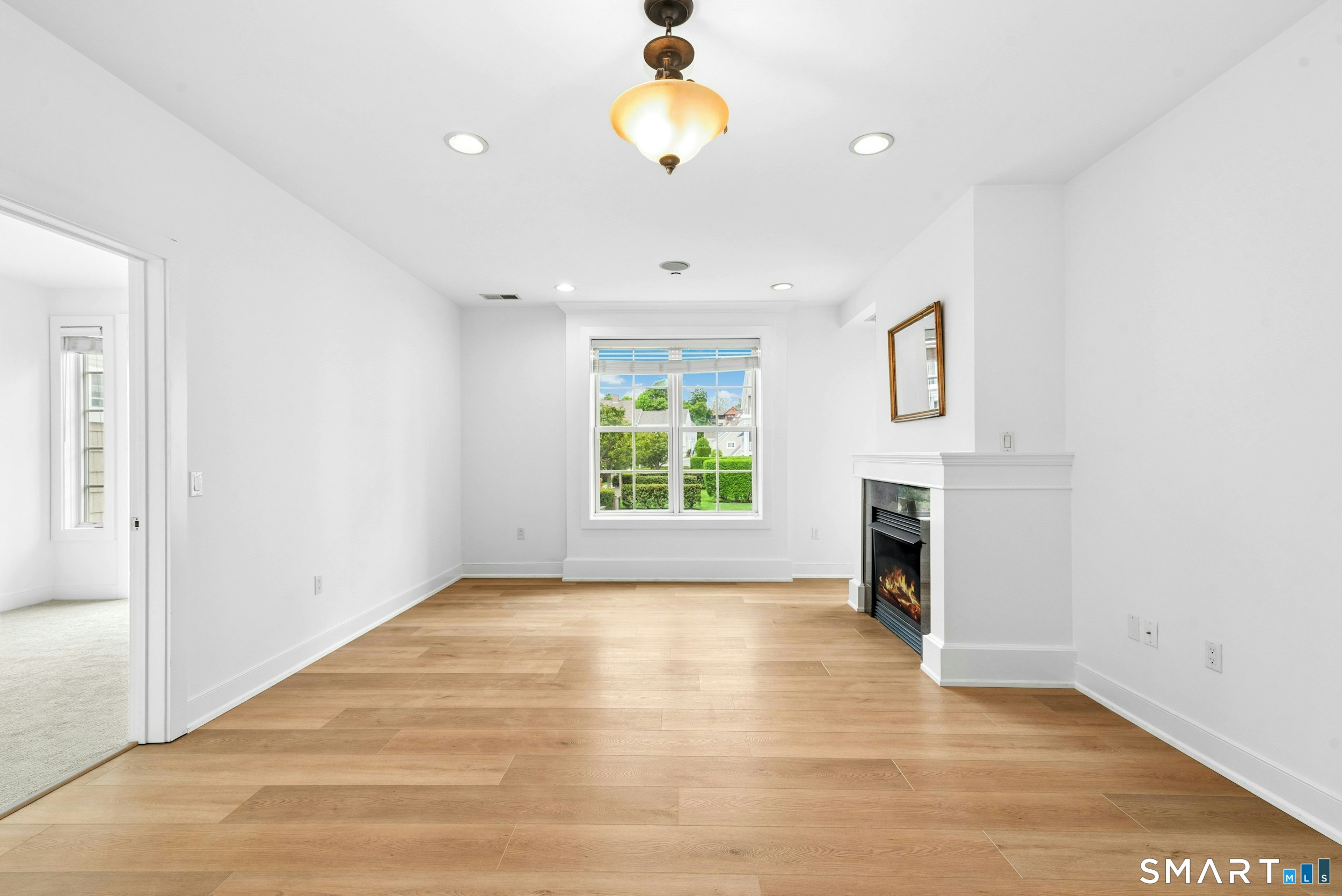 77 Havemeyer Lane, Unit 310 Stamford, CT 06902 - Photo 6 of 22 a view of an empty room with a window