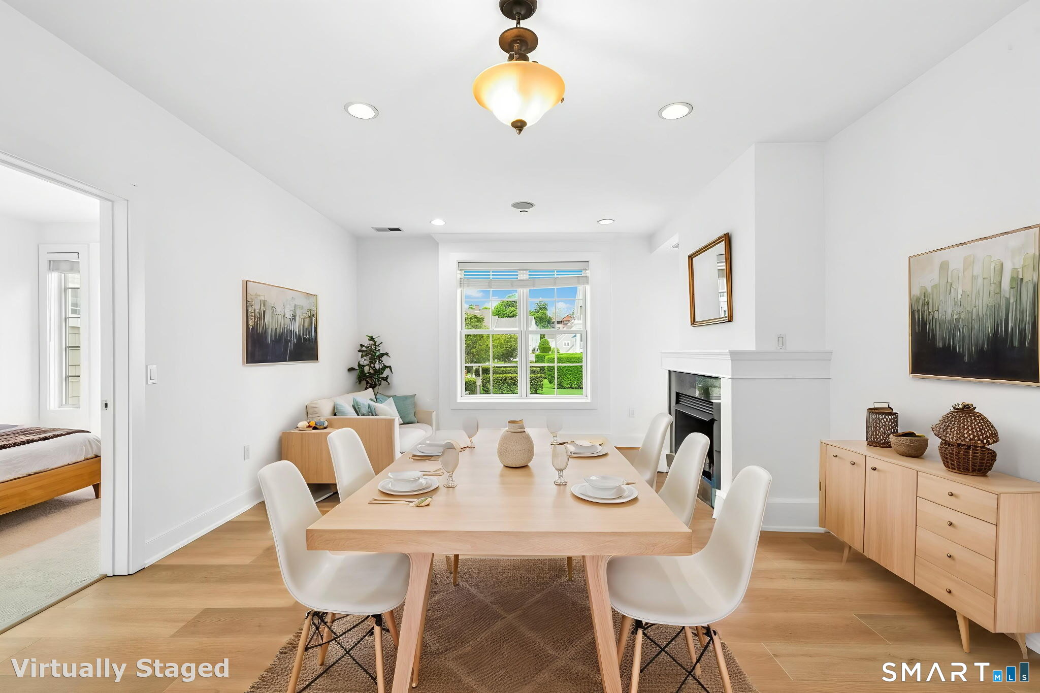 77 Havemeyer Lane, Unit 310 Stamford, CT 06902 - Photo 7 of 22 a view of a dining room with furniture window and wooden floor