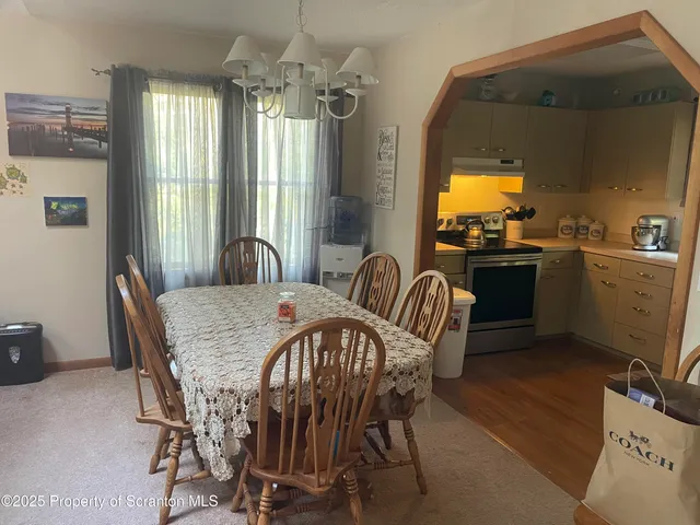 a view of a dining room with furniture window and outside view